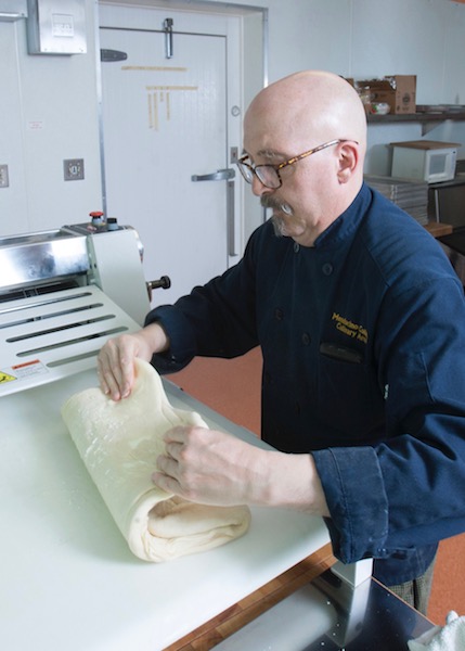culinary instructor working with dough