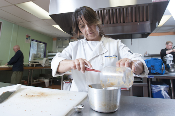 student prepares gravy