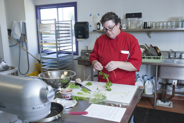 culinary student working with parsley