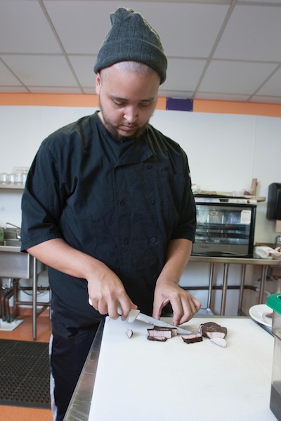 culinary student chopping meat