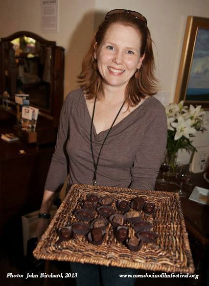Chef Shelley Fields holding a tray of chocolates