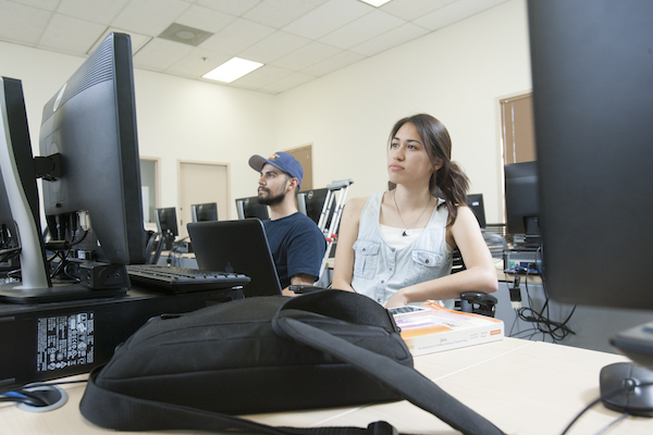 digital arts students boy and girl listening to lecture