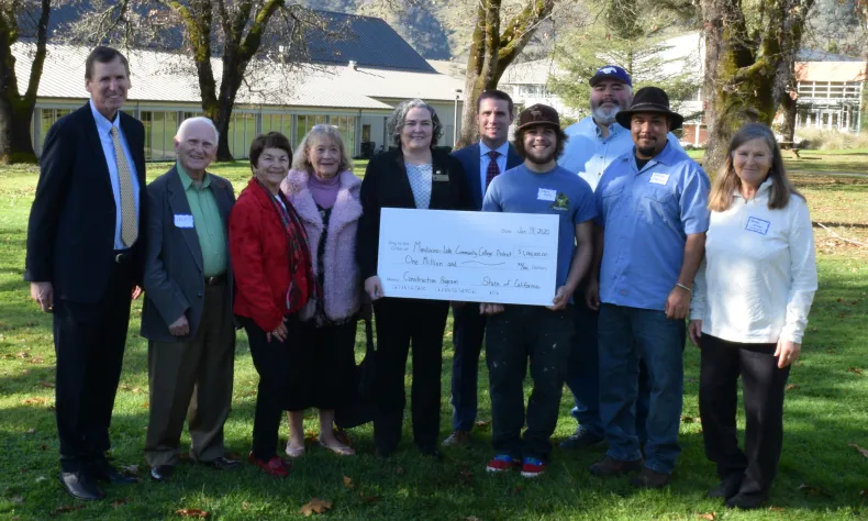 group photo with large check