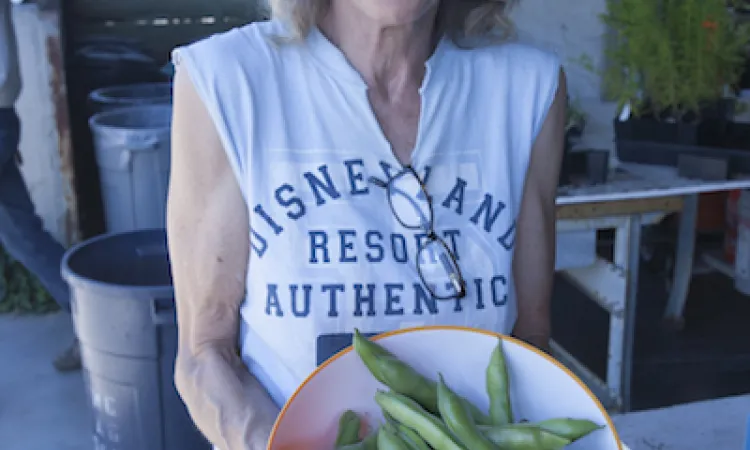 Woman holding vegetables