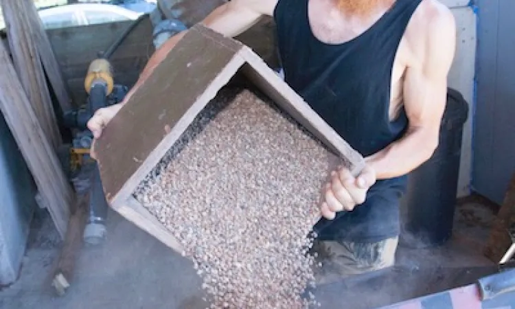 Man pouring soil