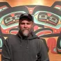 Douglas Prather in front of a mural
